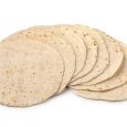 Heap of fresh baked tortilla close up isolated on white background